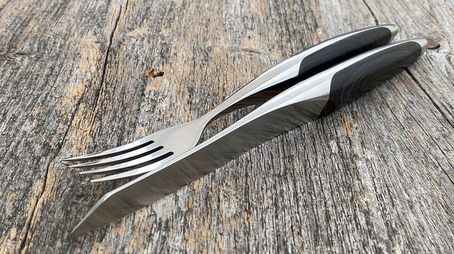 
                    swiss steak cutlery made of surgical steel with ash wood handles