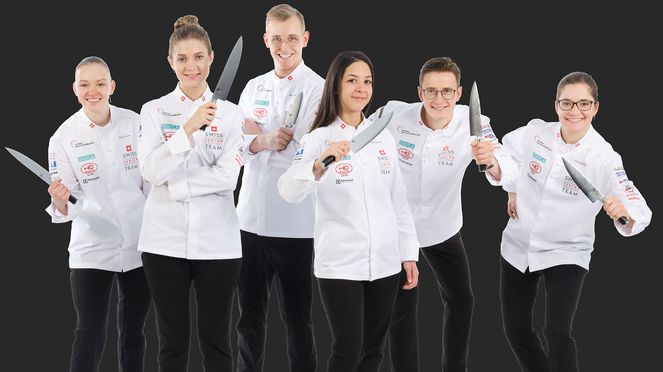 
                    Young national team of cooking with carving knife