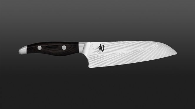 
                    Blade of the Nagare Black Santoku with artistically designed, radial pattern revealing the 72 Damascus layers